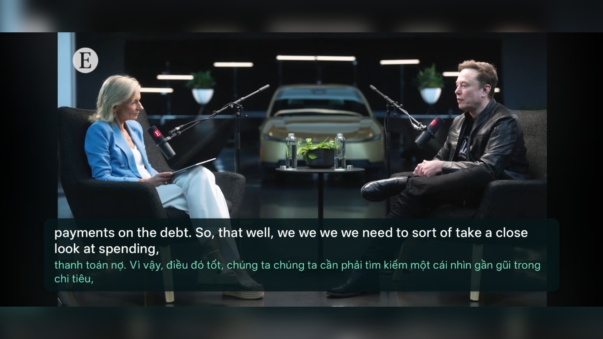Landscape interview video with English subtitles and a Vietnamese translation shown below them